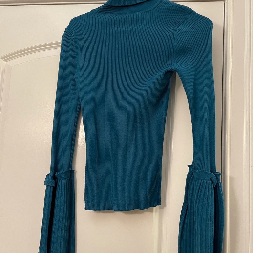 Bell sleeve blue turtleneck sweater